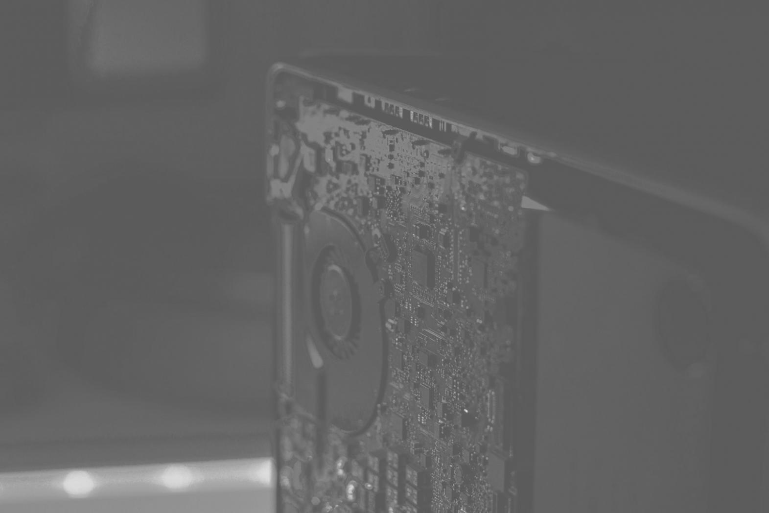 Instructor demonstrating lighting techniques on dual monitors to engaged student